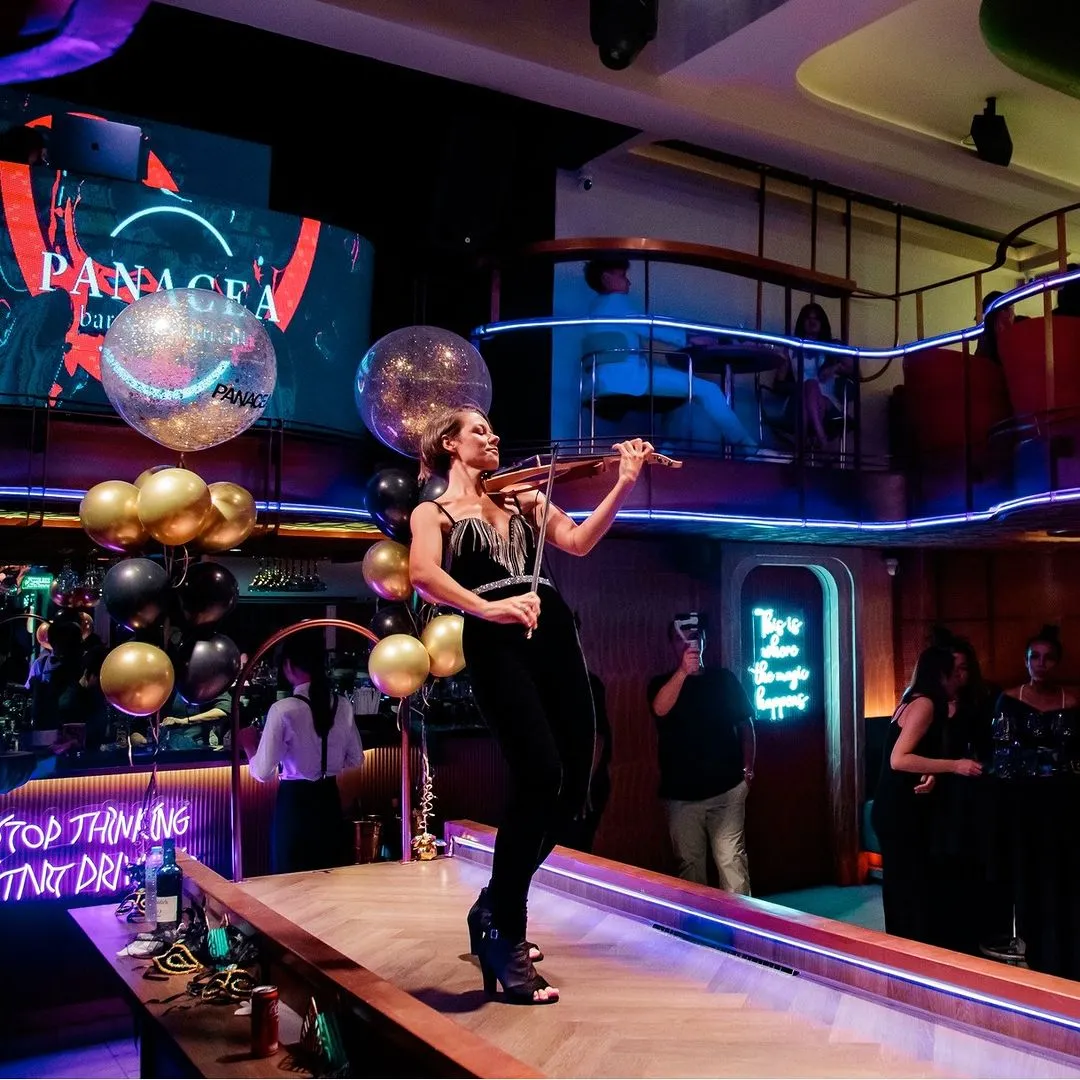 an incredible girl playing the violin at Panacea Restaurant Bar in Bangkok