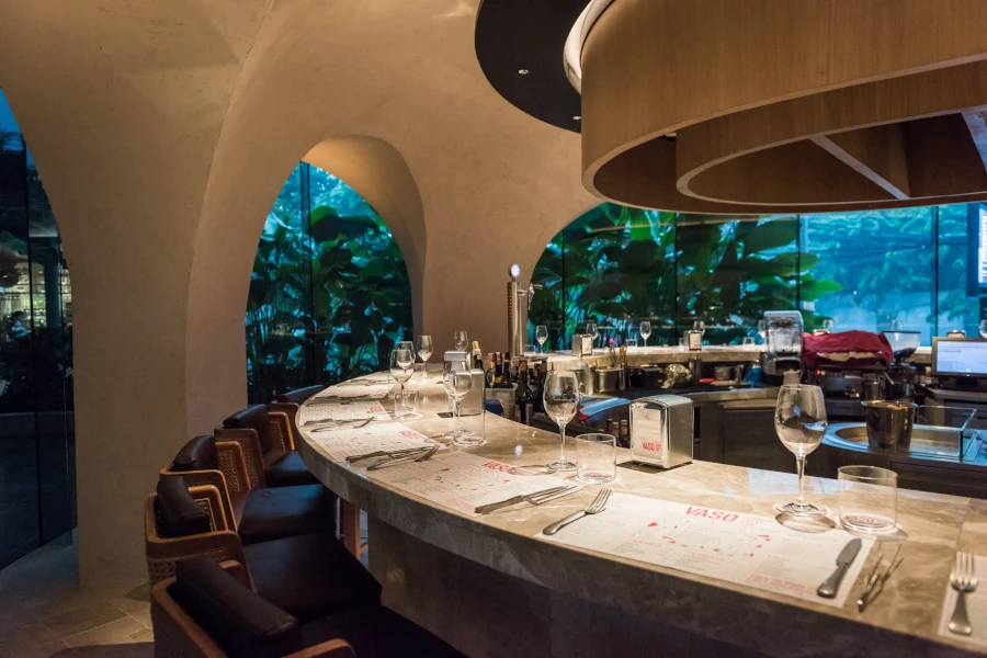awesome interior of vaso restaurant bangkok with marble bar and open kitchen