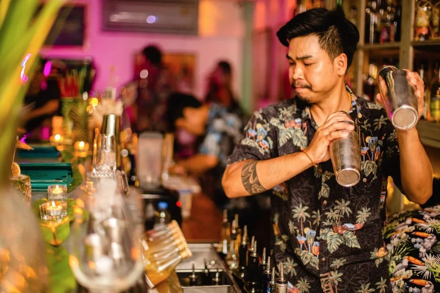 bartender shaking cocktails at Tropic city bar in Bangkok
