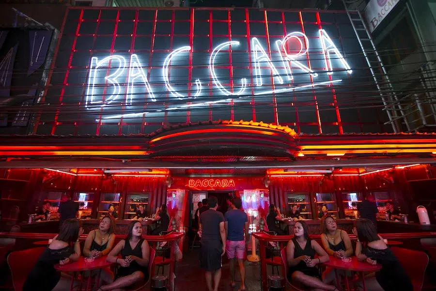 bright white neon sign at the entrance of Baccara Bangkok gogo bar in Soi Cowboy