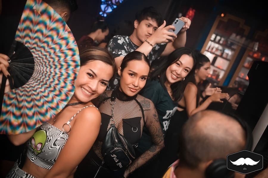 beautiful girls with fan at Mustache club in Bangkok
