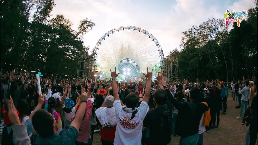 someone with their hands in the air at Big Mountain music festival in Thailand