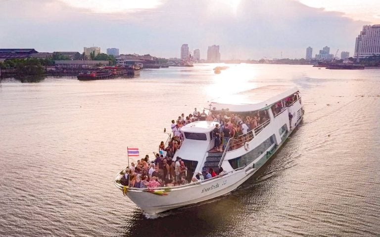 boat party in Bangkok on the chao Phraya river during the sunset