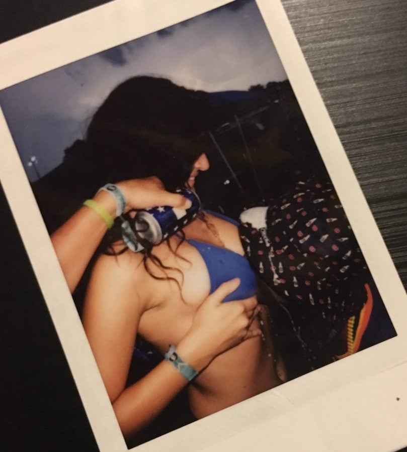 polaroid of a boob luge with beer