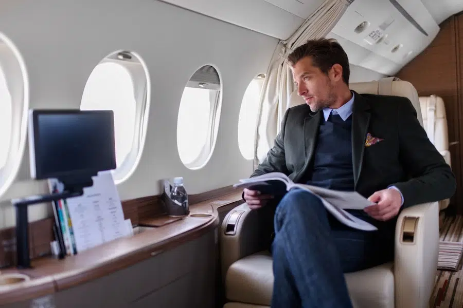 businessman sitting in a private jet charter