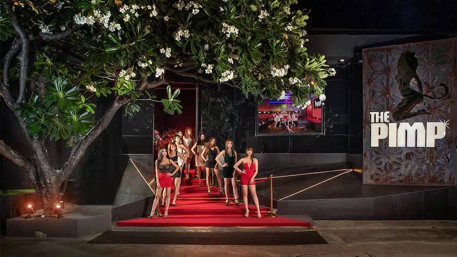 entrance of The PIMP club in Bangkok with sexy party models on the stairs