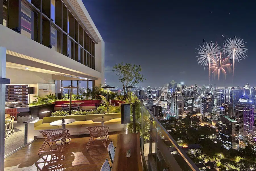 fireworks over Bangkok view from Bar Yard rooftop bar at Kimpton Maa Lai
