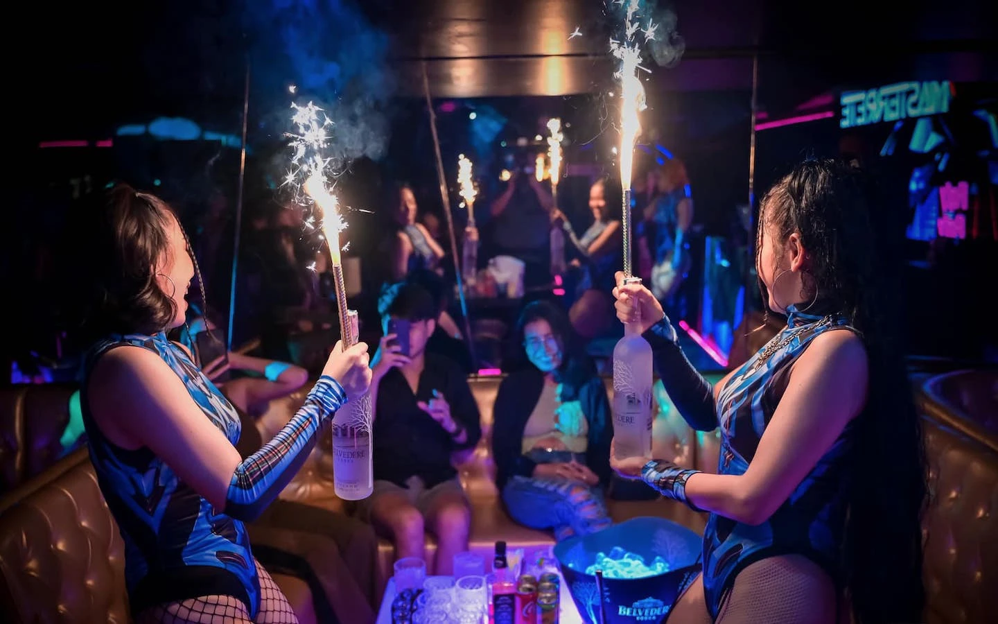 VIP service at the Foxy club in Bangkok with sexy models holding bottles with flares