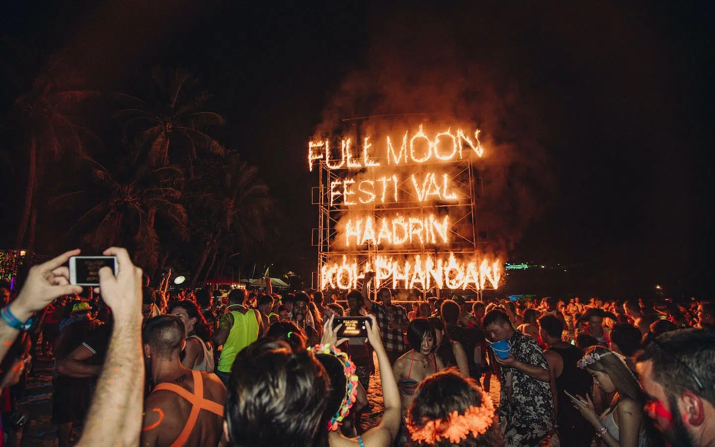 fire sign at the Full Moon Festival in Haad Rin beach in Koh Phangan island in Thailand