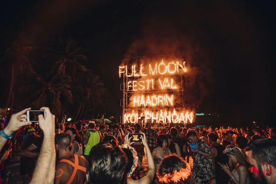 fire sign at The Full Moon Party in Haad Rin beach on Koh Phangan island in Thailand
