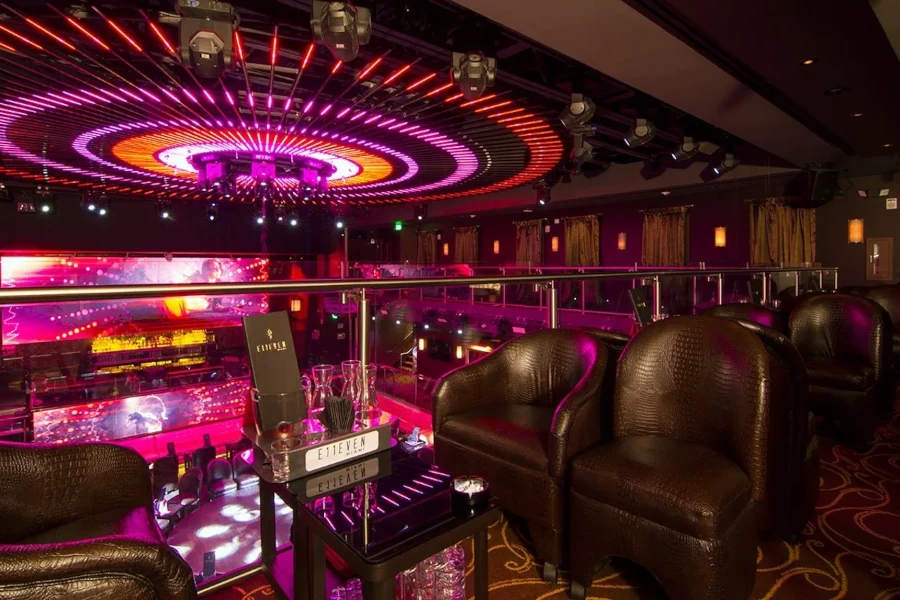 Photo of the interior of E11even nightclub in Miami, with beautiful pink decor and leather seats.