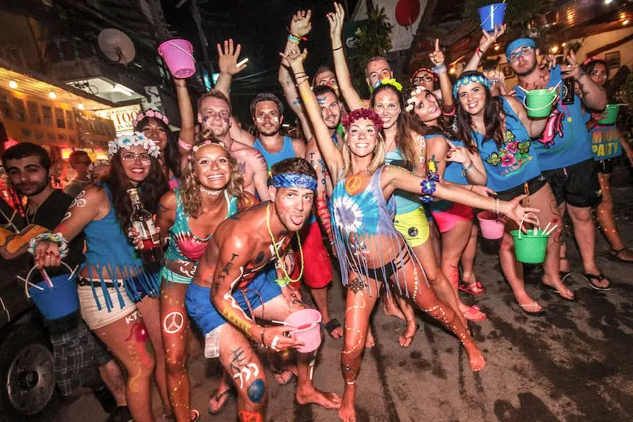 group of tourists partying at the full moon festival in Thailand