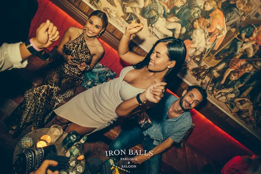 girl dancing at Iron Balls gin parlour in Bangkok