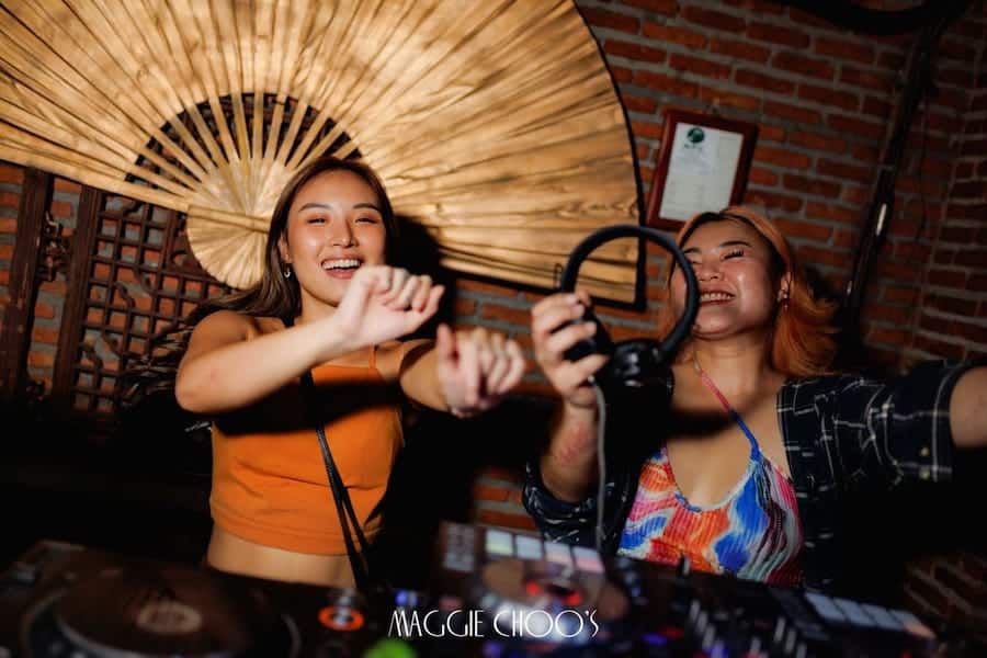 female DJs dancing at Maggie Choo's club
