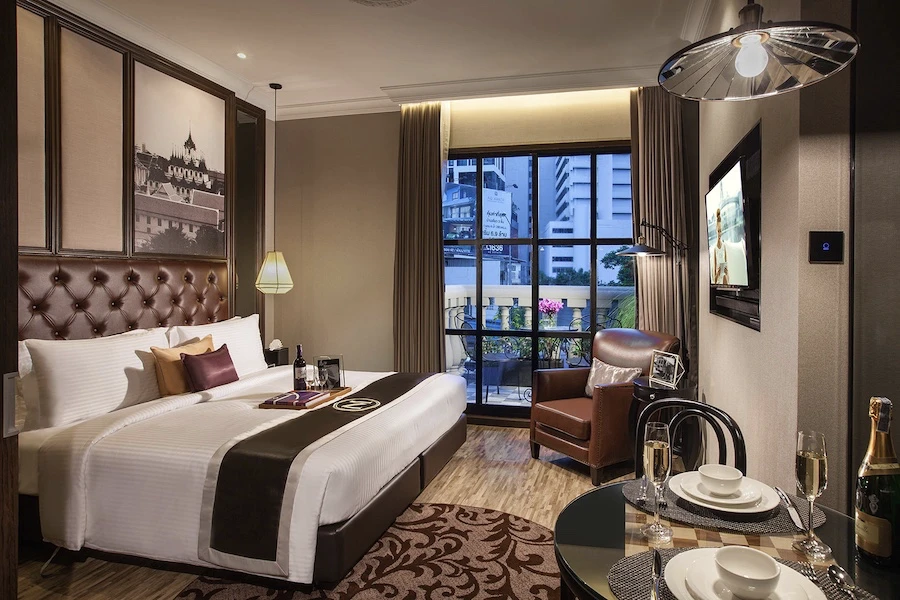 a view of a luxurious room from metropole bangkok hotel