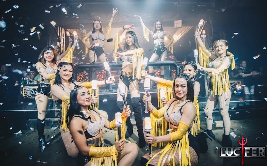sexy Thai dancers holding lights at Lucifer nightclub in Pattaya