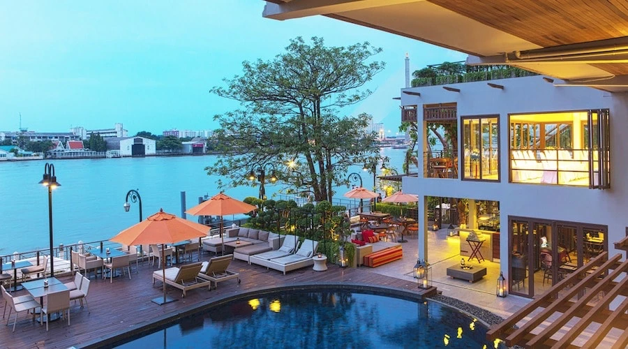 pool by the river at Riva Surya Hotel in Bangkok