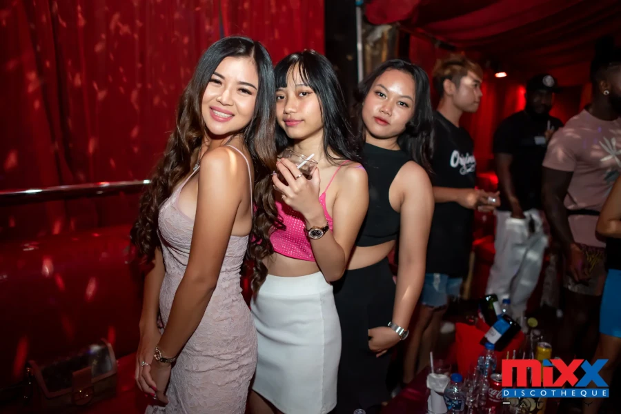 Sexy girls smiling at Mixx Club in Pattaya.