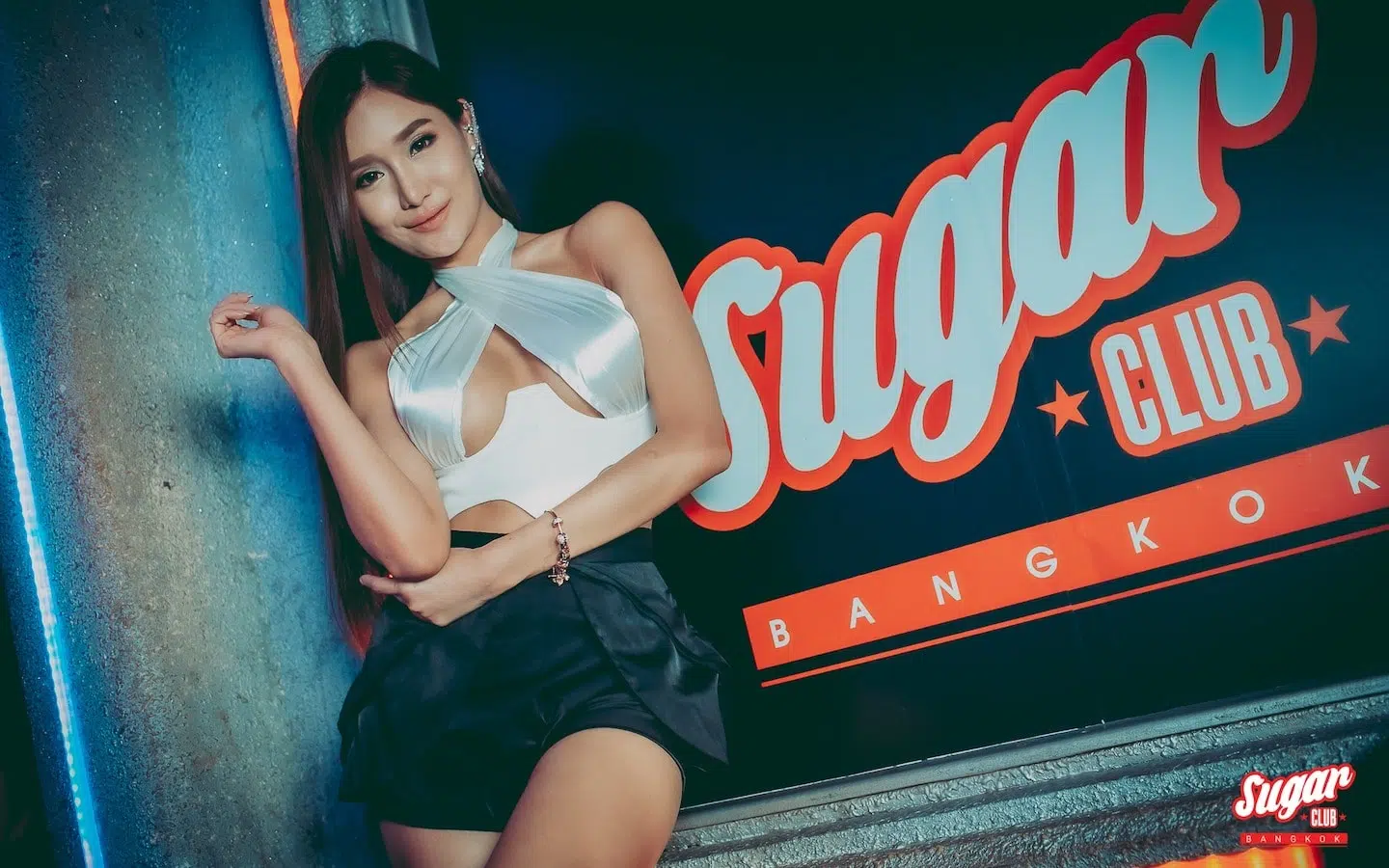 sugar club bangkok sign with Thai girl