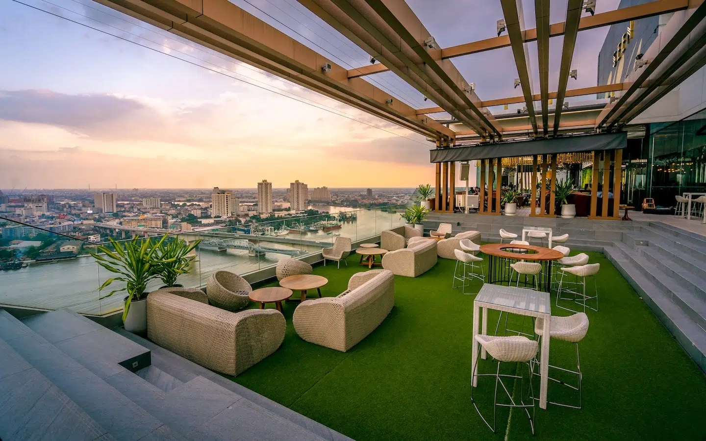 big terrace at a rooftop bar in Bangkok riverside