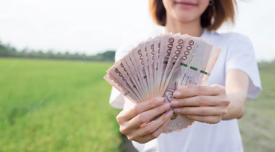 Thai girl holding money