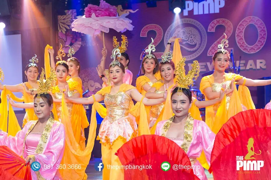 Thai girls performing traditional chinese dances for a chinese new year party