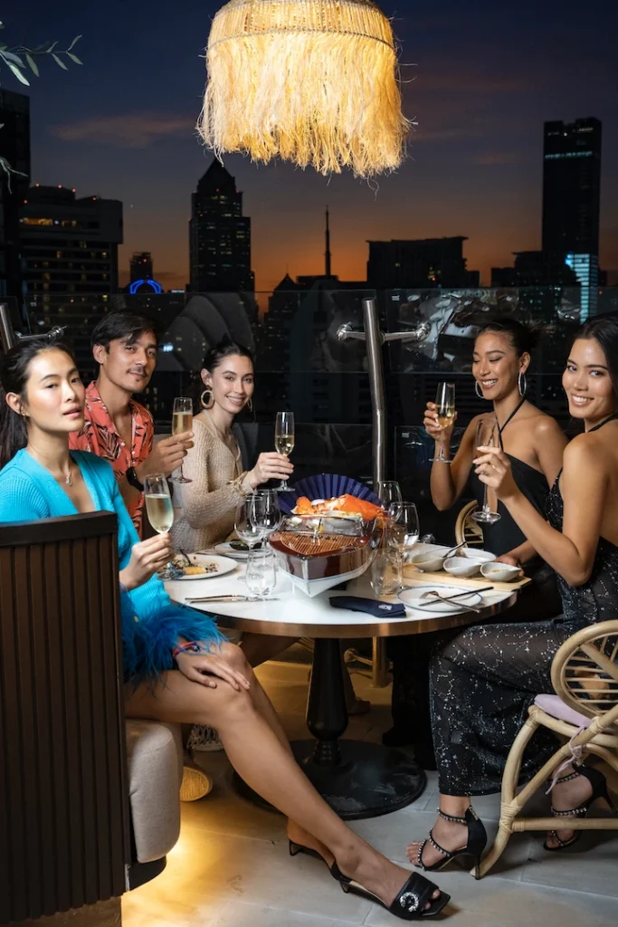 Thai models drinking Champagne at Pastel Bangkok rooftop bar