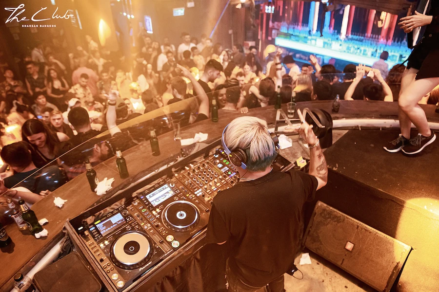 view from the dj booth over a dancing crowd in the club khaosan in Bangkok